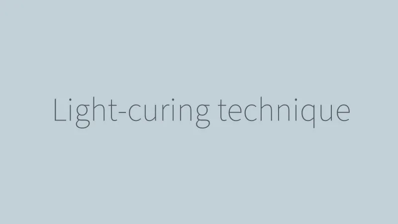 A clinician light-curing a composite repair
